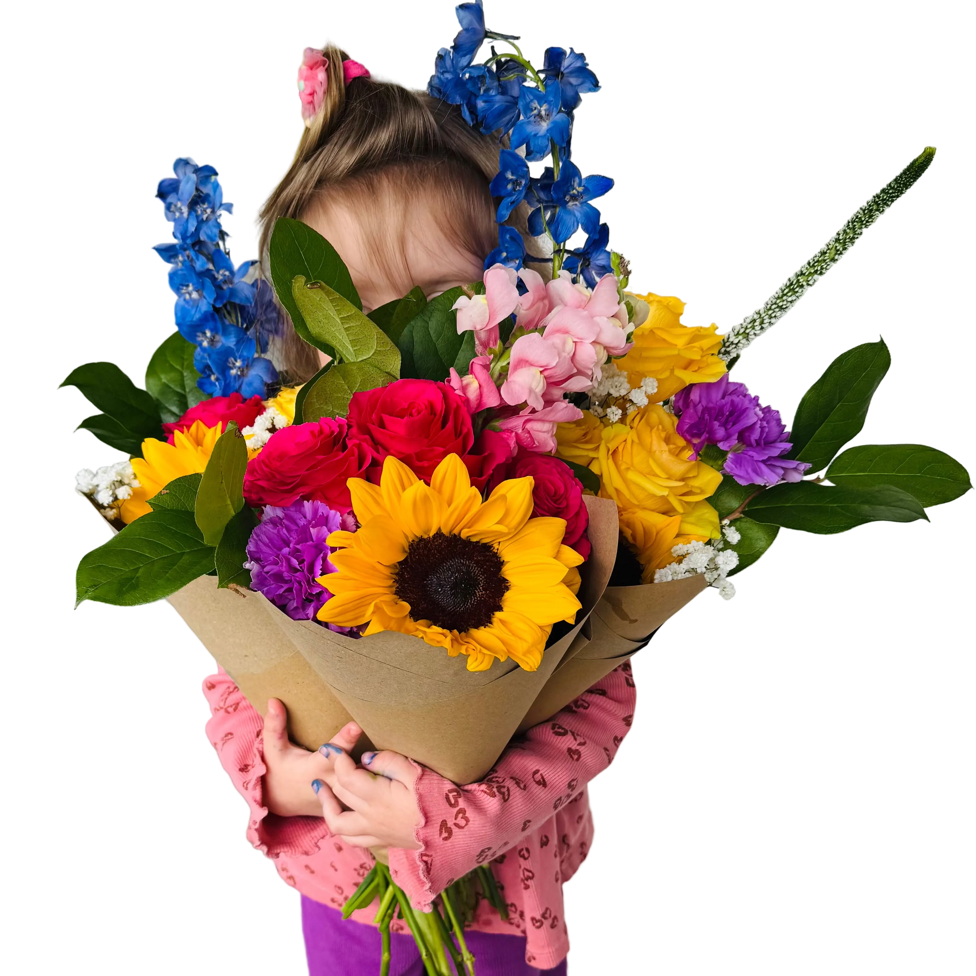 Child holding a large bouquet of colorful flowers on a wooden deck.