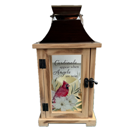 Wooden lantern with a glass panel featuring a cardinal and floral design, on a white background.