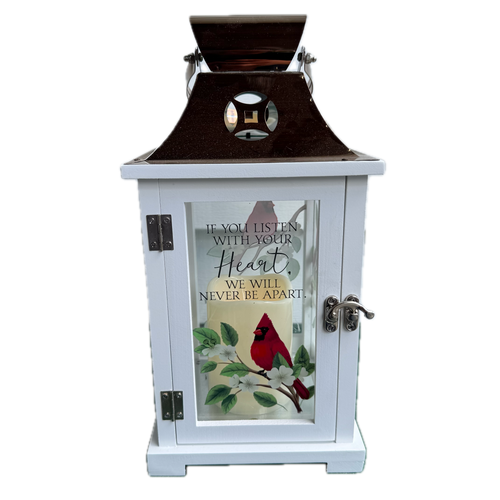 Decorative lantern with a red cardinal design and inspirational quote on a white background